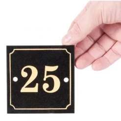 Black & Gold Granite House Sign -House Sign Discount Store Granite sign being held 1